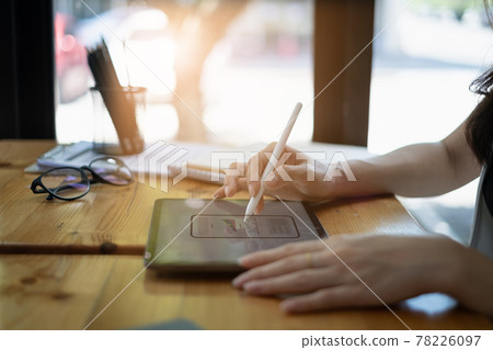 Closeup of female ux developer and ui designer about mobile phone app interface in living room at home.Creative digital development agency concept. 78226097