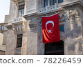 Waving national Turkish Flag on ancient stone wall 78226459