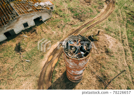 Belarus. Aerial View Of Abandoned Ruined Water Tower Near Farm In Chernobyl Zone. Chornobyl Catastrophe Disasters. Dilapidated House In Belarusian Village. Whole Villages Must Be Disposed. Chernobyl Belarus. Aerial View Of Abandoned Ruined Water Tower Near Farm In Chernobyl Zone. Chornobyl Catastrophe Disasters. Dilapidated House In Belarusian Village. Whole Villages Must Be Disposed. Chernobyl 78226657