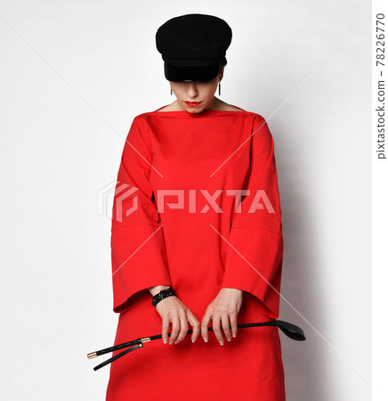 Short haired brunette woman in red casual dress Short haired brunette woman in red casual dress 78226770