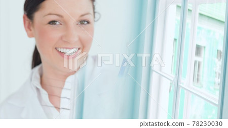 Composition of smiling female caucasian scientist working in laboratory and copy space Composition of smiling female caucasian scientist working in laboratory and copy space 78230030
