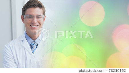 Composition of smiling male doctor, with colourful blurred copy space to right Composition of smiling male doctor, with colourful blurred copy space to right 78230162