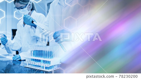 Composition of male and female lab technicians at work, with blurred copy space to right 78230200