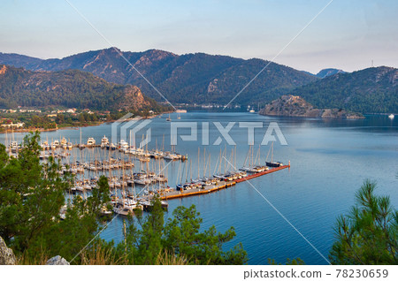 View from the height of the many luxury boats and yachts in the marina at sunset in the Mediterranean Sea.Mugla.Turkey View from the height of the many luxury boats and yachts in the marina at sunset in the Mediterranean Sea.Mugla.Turkey 78230659