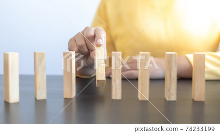 Strategies and risks of wooden games, Close-up of business people gambling with investment risk, Business people play wooden games to simulate planning and strategy for managing business risk. 78233199