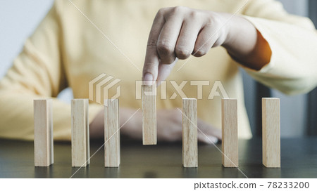 Strategies and risks of wooden games, Close-up of business people gambling with investment risk, Business people play wooden games to simulate planning and strategy for managing business risk. 78233200