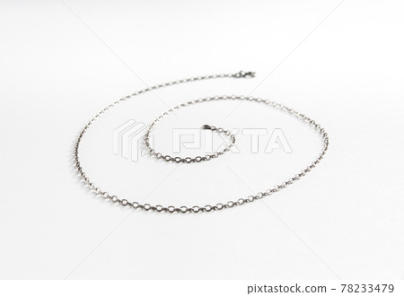 Silver chain necklace isolated on white background Silver chain necklace isolated on white background 78233479