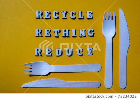 RECYCLE RETHING REDUCE text Wooden forks and paper cups with plates on color background. Eco friendly disposable tableware. Used in fast food, restaurants, takeaways, picnics. No plastic RECYCLE RETHING REDUCE text Wooden forks and paper cups with plates on color background. Eco friendly disposable tableware. Used in fast food, restaurants, takeaways, picnics. No plastic 78234022