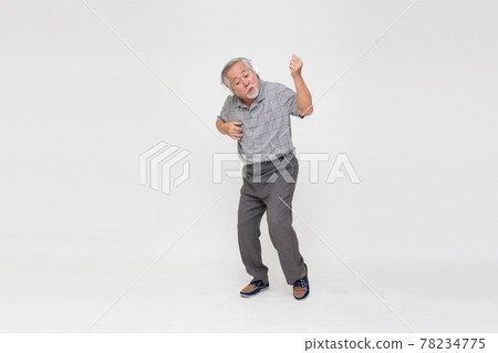 Senior Asian man listening music with headphones and dancing isolated on white background 78234775