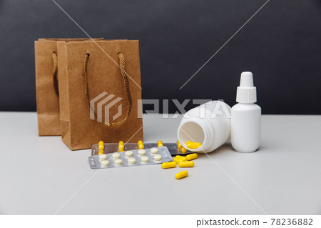Online shoppng concept. Bags with compounded prescription medications shipped from a mail order pharmacy on a grey background 78236882