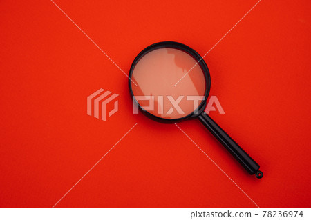 Magnifier on red 78236974