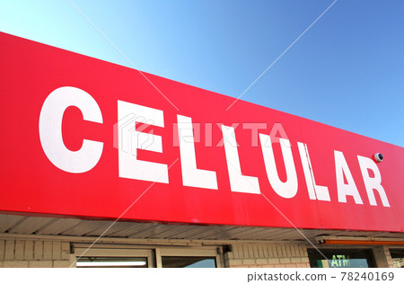 Red and White Cellular Phone Sign on Convenience Store Red and White Cellular Phone Sign on Convenience Store 78240169