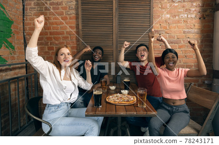 Group of friends watching sport match together. Concept of friendship, leisure activity, emotions 78243171