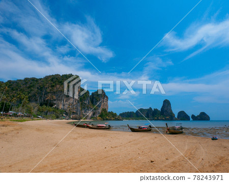 Small boats moored on low tide sandy beaches (Tongsai Beach, Railay, Krabi Province, Kingdom of Thailand) Small boats moored on low tide sandy beaches (Tongsai Beach, Railay, Krabi Province, Kingdom of Thailand) 78243971