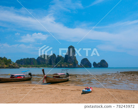 Small boats moored on low tide sandy beaches (Tongsai Beach, Railay, Krabi Province, Kingdom of Thailand) Small boats moored on low tide sandy beaches (Tongsai Beach, Railay, Krabi Province, Kingdom of Thailand) 78243972