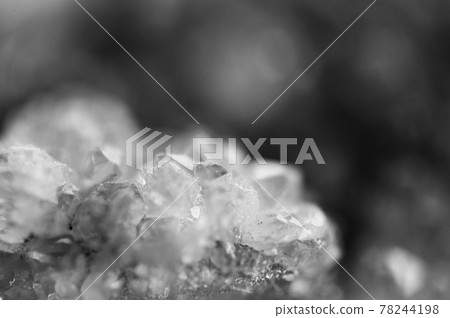 Black and white photograph of the structure of the surface of crystals. Close-up. Blurred background. Black and white photograph of the structure of the surface of crystals. Close-up. Blurred background. 78244198