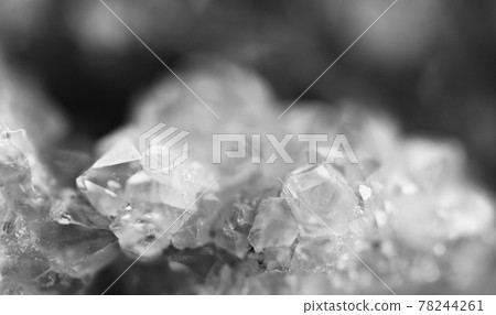 Black and white photograph of the structure of the surface of crystals. Close-up. Blurred background. Black and white photograph of the structure of the surface of crystals. Close-up. Blurred background. 78244261
