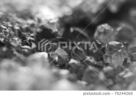 Black and white photograph of the structure of the surface of crystals. Close-up. Blurred background. Black and white photograph of the structure of the surface of crystals. Close-up. Blurred background. 78244268