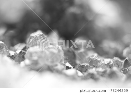 Black and white photograph of the structure of the surface of crystals. Close-up. Blurred background. Black and white photograph of the structure of the surface of crystals. Close-up. Blurred background. 78244269