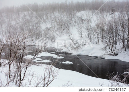 Whinter river in snow, branch in hoar Whinter river in snow, branch in hoar 78246157
