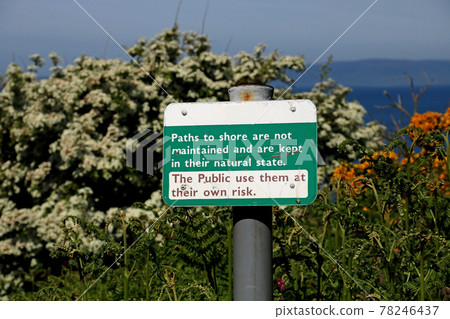 Old Dangerous Path Warning Sign at a Coastal Location Old Dangerous Path Warning Sign at a Coastal Location 78246437