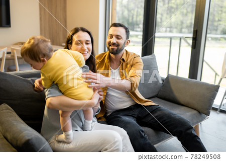 Man works from home with his wife and little son Man works from home with his wife and little son 78249508