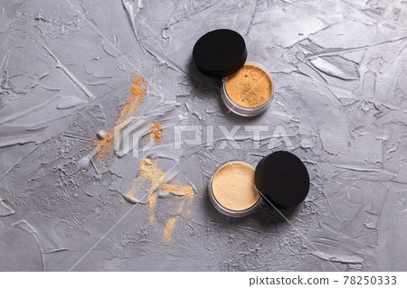 Mineral powder of different colors with a brushes for make-up on wooden background, copyspace 78250333