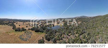 Aerial view of small lake in the valley, between farmland and forest in the town of Julian, east of San Diego, Aerial view of small lake in the valley, between farmland and forest in the town of Julian, east of San Diego, 78251577