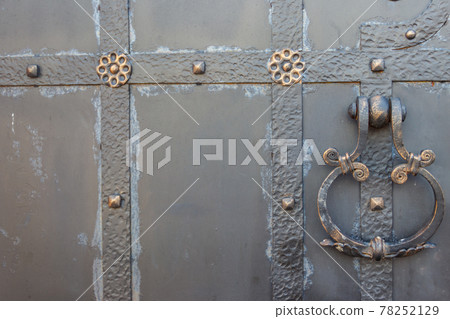 Close-up of the old iron black door Close-up of the old iron black door 78252129