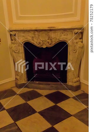 Vintage fireplace in a living room 78252179