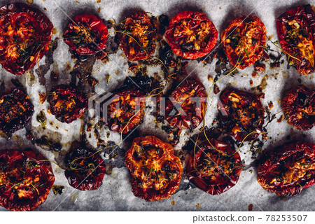 Prepared Sun Dried Tomatoes with Spices on Parchment Paper Prepared Sun Dried Tomatoes with Spices on Parchment Paper 78253507