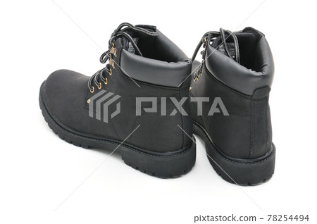 Suede boots with thick soles on a white background Suede boots with thick soles on a white background 78254494