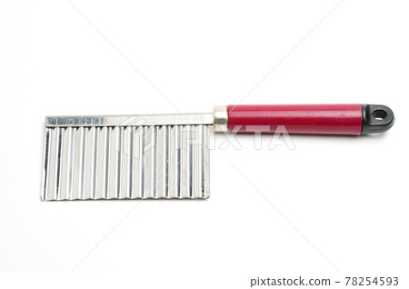 Wavy knife for slicing french fries, vegetable chips and fruits on a white background Wavy knife for slicing french fries, vegetable chips and fruits on a white background 78254593