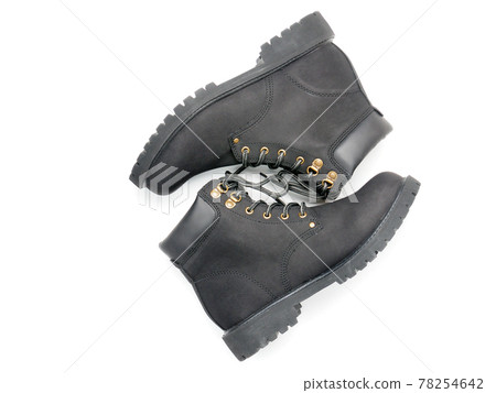 Suede boots with thick soles on a white background 78254642