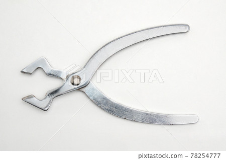 Metal sugar cutters on white background Metal sugar cutters on white background 78254777