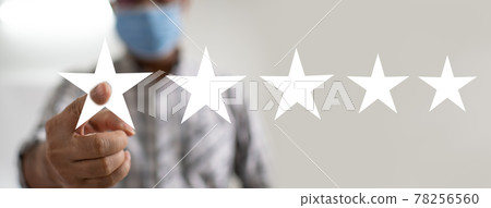 Concept of doing business to achieve goals And victory in market competition. Businessman pointing a finger at a white star. Men showed results that had exceeded their expectations. Blurred Background Concept of doing business to achieve goals And victory in market competition. Businessman pointing a finger at a white star. Men showed results that had exceeded their expectations. Blurred Background 78256560