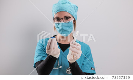 Young doctor has a PCR test in her hands Young doctor has a PCR test in her hands 78257339