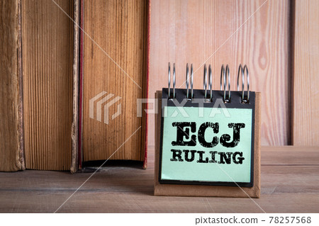 ECJ RULING. European Court of Justice concept. Wooden bookshelf with books 78257568