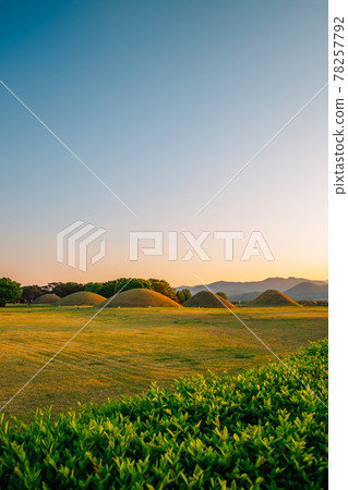 Sunset of Inwang-dong ancient tomb complex in Gyeongju, Korea 78257792