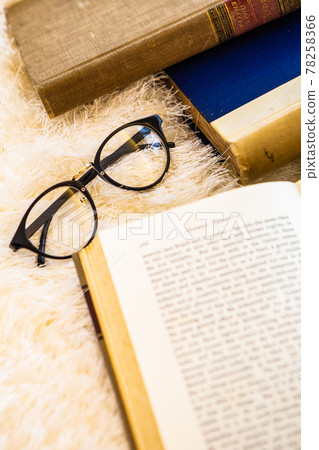 Material image of classic image of foreign books and glasses 78258366