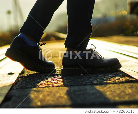 Man walking outside in the evening 78260115