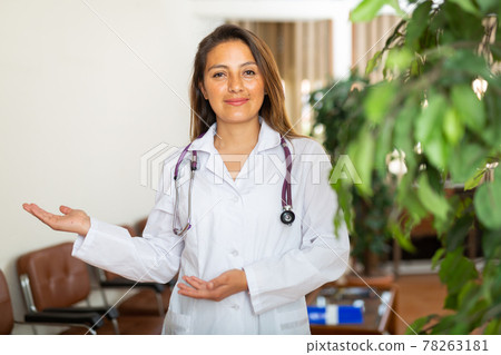 Confident woman doctor standing in office 78263181
