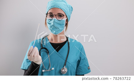 Young doctor has a PCR test in her hands 78263722