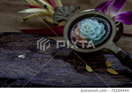 Traditional Thai desserts sweet and delicious : Thai Layer Sweet Cake or Kanom Chan desserts that made in various flower pattern such as roses. 78264444