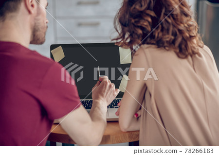 Team members working on a project together 78266183