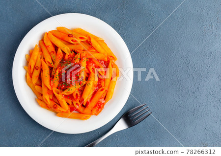 Penne Arrabiata and fork (overhead view / copy space) Penne Arrabiata and fork (overhead view / copy space) 78266312