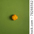 yellow pepper on a green background, fresh vegetable 78266562
