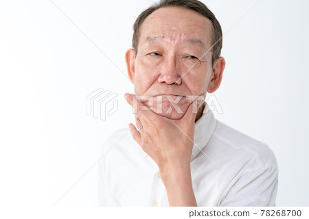 Senior man touching the chin Senior man touching the chin 78268700