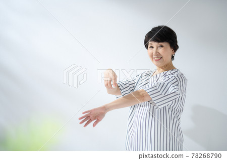 Senior woman sunscreen insect repellent Senior woman sunscreen insect repellent 78268790