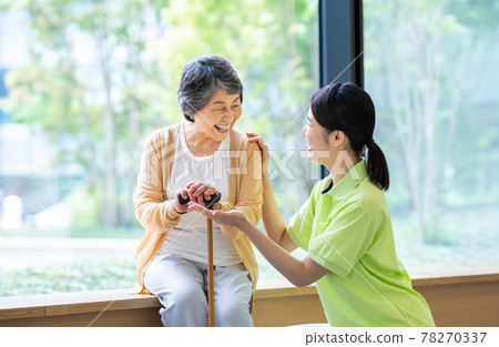 Elderly and young certified care workers in nursing care facilities Photographing cooperation "LINK FOREST" 78270337